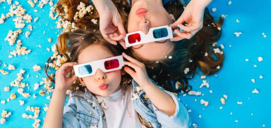 view-from-funny-mother-daughter-laying-floor-having-fun-camera-popcorn-isolated-blue-background-fashionable-family-jeans-clothes-wearing-3d-glasses-express.jpg