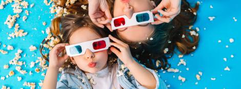 view-from-funny-mother-daughter-laying-floor-having-fun-camera-popcorn-isolated-blue-background-fashionable-family-jeans-clothes-wearing-3d-glasses-express.jpg